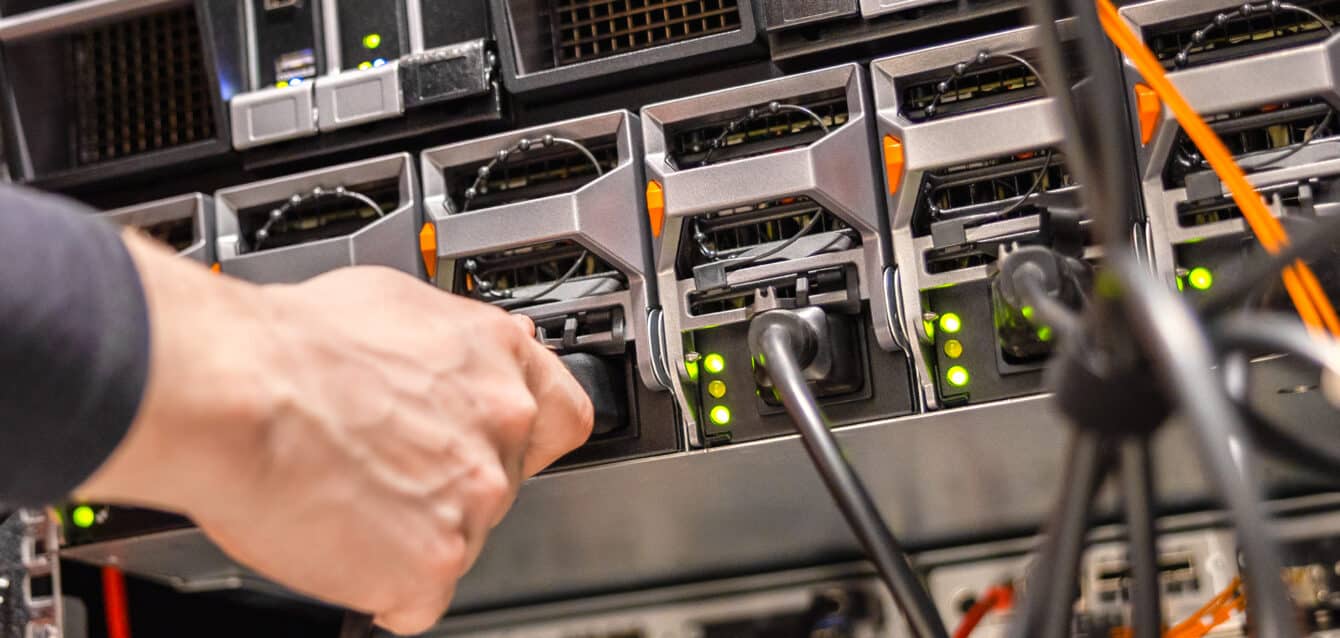 Close-up of Male Technician Plugging Computer Cable In San Fix IP Canonicalization issues on your website | Wedu Media Tutorials