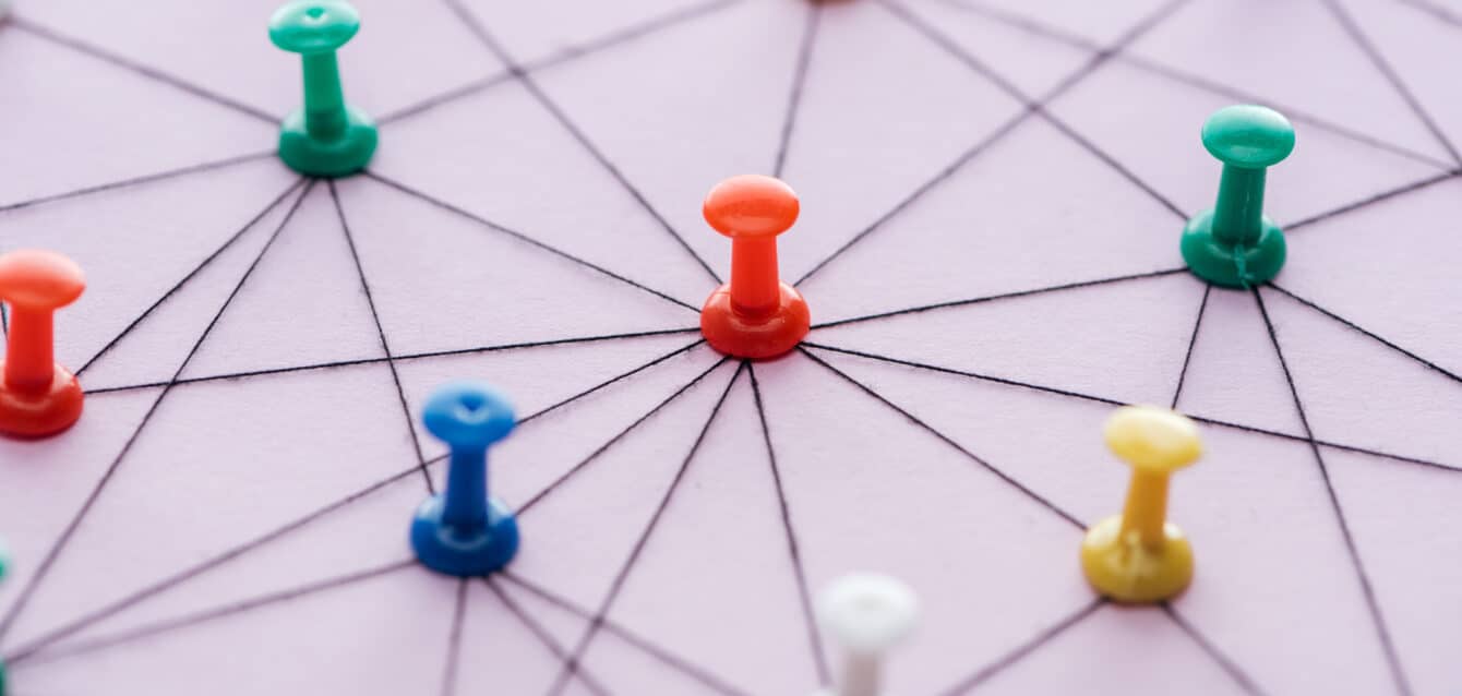selective focus of push pins connected with strings Isolated On pink, network concept These three HTML attributes—DoFollow, NoFollow, and NoIndex—act as communication tools between your website and search engines